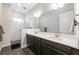 Modern bathroom featuring double vanity, framed mirror and a glass enclosed shower at 10255 Beechwood Ln, Orlando, FL 32832