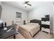 Bedroom with neutral walls, window and simple decor and a dedicated desk area at 10255 Beechwood Ln, Orlando, FL 32832