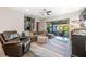 Comfortable living room featuring a plush sofa, stylish decor, and seamless access to the outdoor patio area at 10255 Beechwood Ln, Orlando, FL 32832