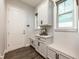 Bright mudroom features custom cabinets, granite counters, bench seating, and access to the home's entry door at 10255 Beechwood Ln, Orlando, FL 32832