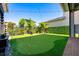 Enjoy outdoor leisure with this manicured backyard putting green, perfect for recreation and relaxation at 10255 Beechwood Ln, Orlando, FL 32832
