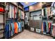 Custom walk-in closet with modern storage solutions and illuminated with blue LED lighting at 10255 Beechwood Ln, Orlando, FL 32832