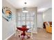 Cozy dining area with modern lighting fixture, wood table, and a decorative fish decoration at 112 Coventry Ln, Haines City, FL 33844