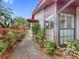 Home exterior featuring well-kept landscaping and a walkway leading to the house; a well-maintained pathway at 112 Coventry Ln, Haines City, FL 33844