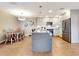 Modern kitchen with granite countertops, stainless steel appliances, and a kitchen island overlooking the dining area at 112 Coventry Ln, Haines City, FL 33844