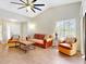 Spacious living room filled with leather furniture, and hardwood floors at 112 Coventry Ln, Haines City, FL 33844