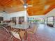 Outdoor dining area with ceiling fans and decorative tile flooring at 112 Coventry Ln, Haines City, FL 33844