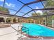 Enclosed pool with seating area for a relaxing outdoor experience at 112 Coventry Ln, Haines City, FL 33844