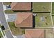 Aerial shot of homes featuring terra cotta tile roofs and well-maintained yards in a residential neighborhood at 1158 Oak Bluff Dr, Davenport, FL 33837