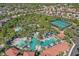 An aerial view showcasing the community pool, tennis courts, and surrounding residences, highlighting the desirable neighborhood at 1158 Oak Bluff Dr, Davenport, FL 33837