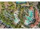 Community features include a lazy river, pool, lounge chairs, palm trees, cabanas, and lush landscaping at 1158 Oak Bluff Dr, Davenport, FL 33837