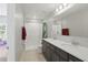 Bathroom showcasing double sinks and a shower with a shower curtain at 1158 Oak Bluff Dr, Davenport, FL 33837