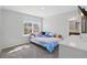 Bright bedroom featuring a window with a view and neutral color palette at 1158 Oak Bluff Dr, Davenport, FL 33837