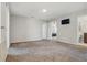 Spacious bedroom with plush carpet and three entryways to other rooms in the house at 1158 Oak Bluff Dr, Davenport, FL 33837