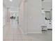 Inviting entryway showcasing neutral tile flooring and convenient built-in storage at 1158 Oak Bluff Dr, Davenport, FL 33837
