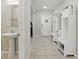 Bright foyer with decorative storage cabinets and a convenient half bath at 1158 Oak Bluff Dr, Davenport, FL 33837