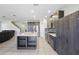 Spacious kitchen with a large island, dark cabinetry, stainless appliances, and open access to living areas at 1158 Oak Bluff Dr, Davenport, FL 33837