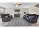 Comfortable living room with plush seating, TV, and entertainment center at 1158 Oak Bluff Dr, Davenport, FL 33837