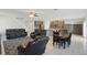Spacious living space with a dining table and chairs, tile flooring and an open flow to the kitchen at 1158 Oak Bluff Dr, Davenport, FL 33837