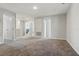 Well-lit loft area with plush carpet, multiple entryways and space for activities at 1158 Oak Bluff Dr, Davenport, FL 33837