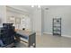 Versatile room with neutral walls and tile flooring, ideal for a home office setup at 1158 Oak Bluff Dr, Davenport, FL 33837