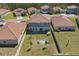 Aerial view of a home with a fenced backyard, patio area, and well-manicured lawn at 1158 Oak Bluff Dr, Davenport, FL 33837