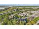 Aerial view of townhome community with lush trees and highway nearby, showcasing location and accessibility at 1284 Pavia Dr, Apopka, FL 32703