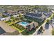 Beautiful aerial view of townhomes with a community pool, landscaping, and private patios at 1284 Pavia Dr, Apopka, FL 32703