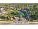 Community entrance with landscaping; picturesque street view showcases well-maintained properties and lush greenery at 1284 Pavia Dr, Apopka, FL 32703