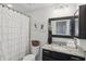 Cozy bathroom featuring a vanity with granite countertops, toilet and shower with curtain at 1284 Pavia Dr, Apopka, FL 32703