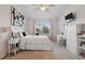 Bright bedroom with a comfortable bed, a study desk, and a serene view from the window at 1284 Pavia Dr, Apopka, FL 32703
