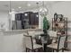Bright dining area with elegant lighting and view of the kitchen at 1284 Pavia Dr, Apopka, FL 32703
