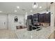 Bright kitchen with stainless steel appliances, dark wood cabinets, a center island, and granite countertops at 1284 Pavia Dr, Apopka, FL 32703