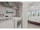 Efficient laundry area conveniently located near bedroom with modern machines and ample storage; simplifying chores at 1284 Pavia Dr, Apopka, FL 32703