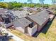 Aerial view of the home and community with beautiful surroundings and lush greenery at 140 Pinesong Dr, Casselberry, FL 32707