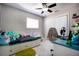 Bedroom featuring bright windows, a ceiling fan, and spacious closet at 140 Pinesong Dr, Casselberry, FL 32707
