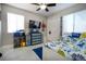 Bright bedroom with a ceiling fan, closet, and a window providing natural light at 140 Pinesong Dr, Casselberry, FL 32707