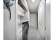 Clean laundry room with modern washer and dryer, built-in storage, and tiled flooring at 140 Pinesong Dr, Casselberry, FL 32707
