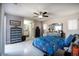 Spacious main bedroom with a modern ceiling fan, tiled flooring, and ensuite access at 140 Pinesong Dr, Casselberry, FL 32707