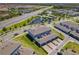 Aerial view showcases well-maintained community with ponds and lush landscaping near roadways at 14432 Orchid Island Dr, Orlando, FL 32827