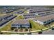 Aerial view of a residential neighborhood with well-maintained townhomes and green spaces at 14432 Orchid Island Dr, Orlando, FL 32827