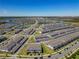 Expansive aerial view of the community with lakes, manicured landscapes, and residential homes at 14432 Orchid Island Dr, Orlando, FL 32827