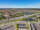 Community aerial view featuring lakes, fountains, modern homes, and convenient road access at 14432 Orchid Island Dr, Orlando, FL 32827