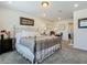 Spacious bedroom featuring a decorative metal bed frame and a plush grey carpet at 14432 Orchid Island Dr, Orlando, FL 32827