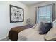 Bedroom with a cozy bed, bedside decor, overhead lighting, and a bright window view at 14432 Orchid Island Dr, Orlando, FL 32827