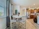 Bright breakfast nook with dining table near kitchen, featuring hardwood flooring at 14432 Orchid Island Dr, Orlando, FL 32827