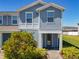 Charming two-story townhome with inviting entrance and manicured landscaping at 14432 Orchid Island Dr, Orlando, FL 32827