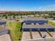 Townhome featuring brick driveways and attached garages, complemented by manicured landscaping at 14432 Orchid Island Dr, Orlando, FL 32827