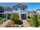 Charming townhome with a beautiful flowering tree and brick paver walkway at 14432 Orchid Island Dr, Orlando, FL 32827