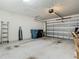 Spacious two-car garage with an automatic door and plenty of storage space at 14432 Orchid Island Dr, Orlando, FL 32827